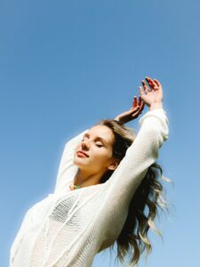 woman in white knit sweater